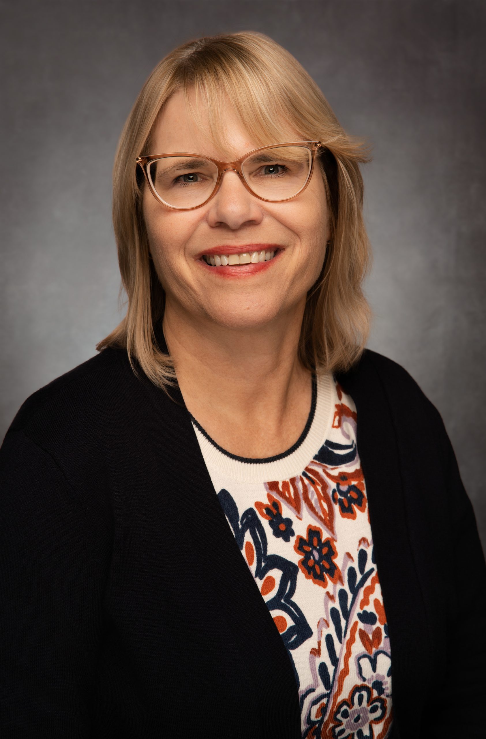 A portrait of associate clinical professor Millicent Malcolm.